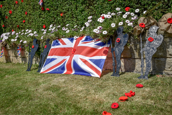 flowers and flag for Armistice Day (UK Veterans Day)